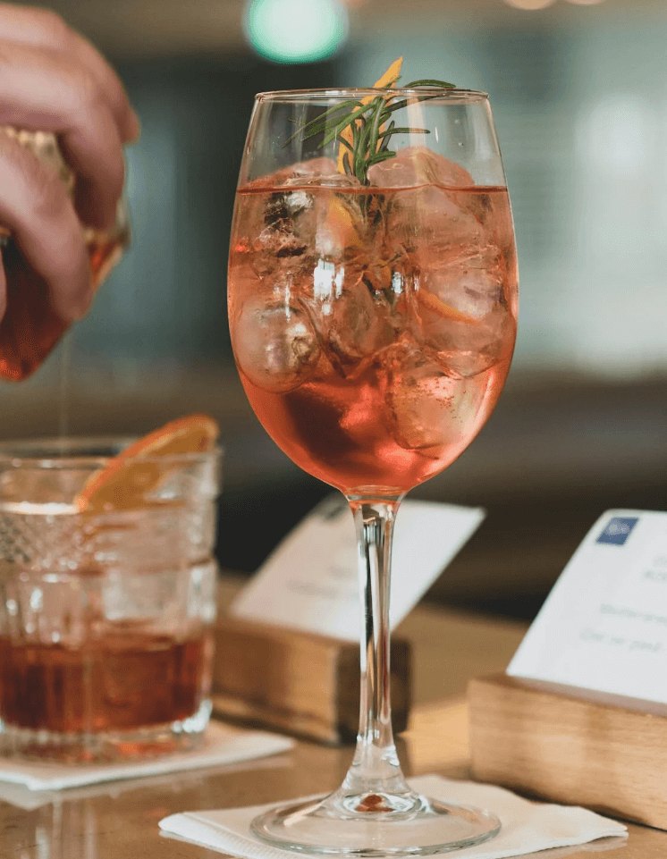 A wine glass and a short tumbler